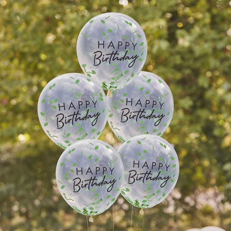 Une Fête D'anniversaire Verte Et Dorée Avec Un Ballon Vert Et Un Gâteau Sur  La Table.